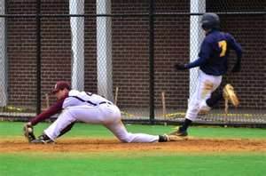 First baseman John Zierold scoops the ball up at first.