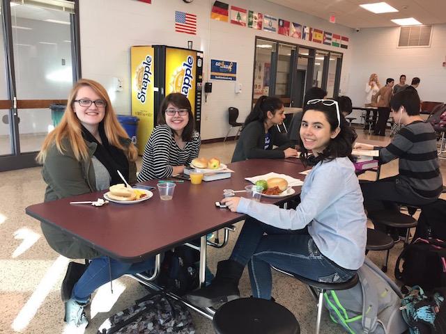 Seniors Kaitlyn Bolwell, Aneta Ostasz and Stephanie Giraldo discuss schoolwork while enjoying their breakfast.