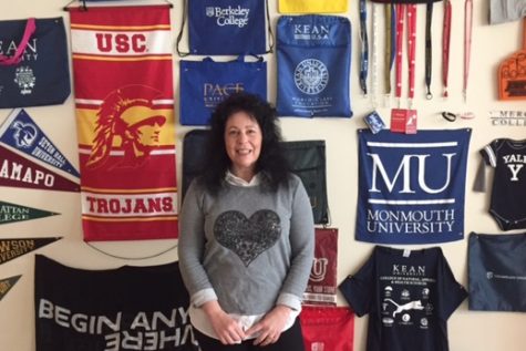 Mrs. Ferris, who has been the senior class adviser for 28 years, decorates her room with college memorabilia.