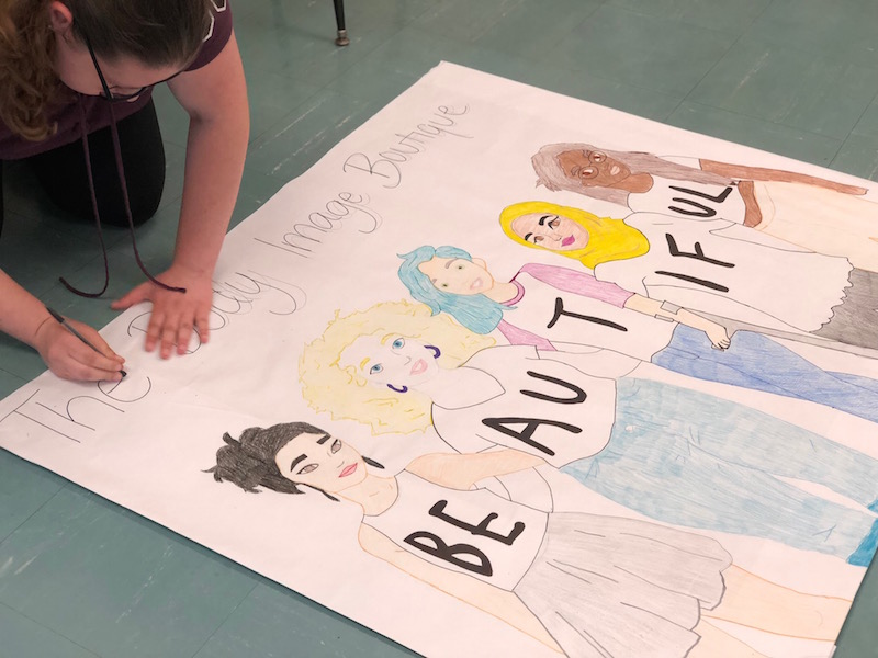 Rebecca Collette, along with several GHG members, recreated a design that illustrates how beauty comes in many forms and reminds teens to stay positive.