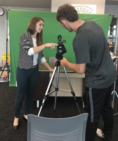 Mrs. Colangelo shows a Becton student the proper way to use the newly purchased equipment.