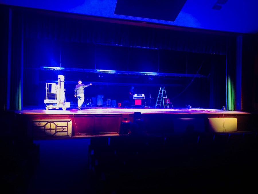 Mr. Phil Caputo, Supervisor of Building and Grounds, tests out the stage lighting with the high schools custodial staff.