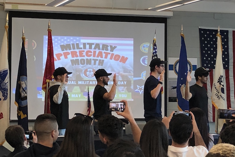 Cole Willis, Sebastian Cardona, Matthew Chattaway, and Kier Alexander repeat the Oath of Enlistment for Military Service on May 1.