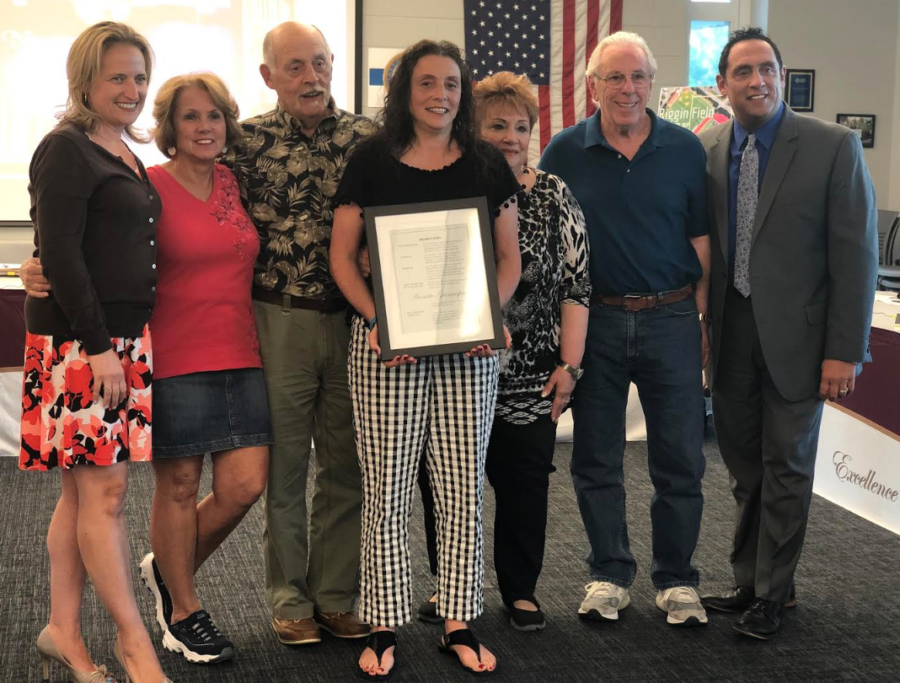 Mrs. Giancaspro is surrounded by her family members at the June BOE meeting where she was recognized for achieving such a wonderful accomplishment.