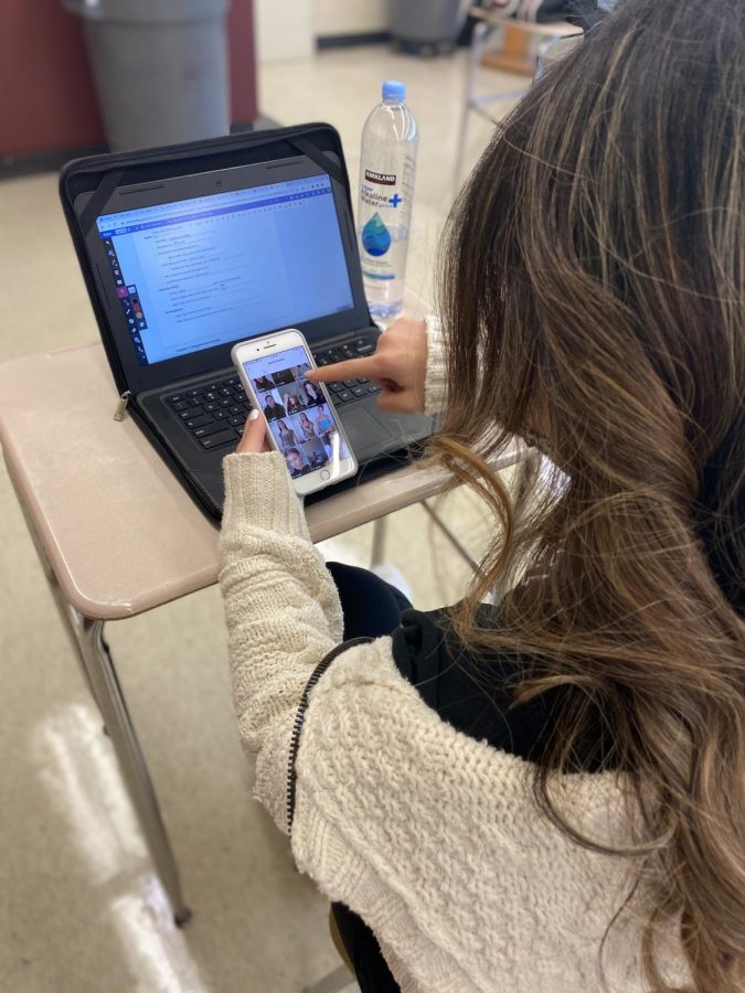 A student sneaks a peak at Instagram after submitting their assignment.