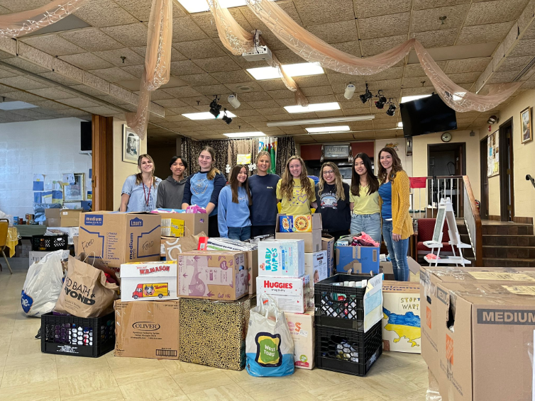 Becton Senior Volunteers, along with Amanda Colangelo and Sharon Skeehan, dropping off all of the donations that were collected among the four schools.
