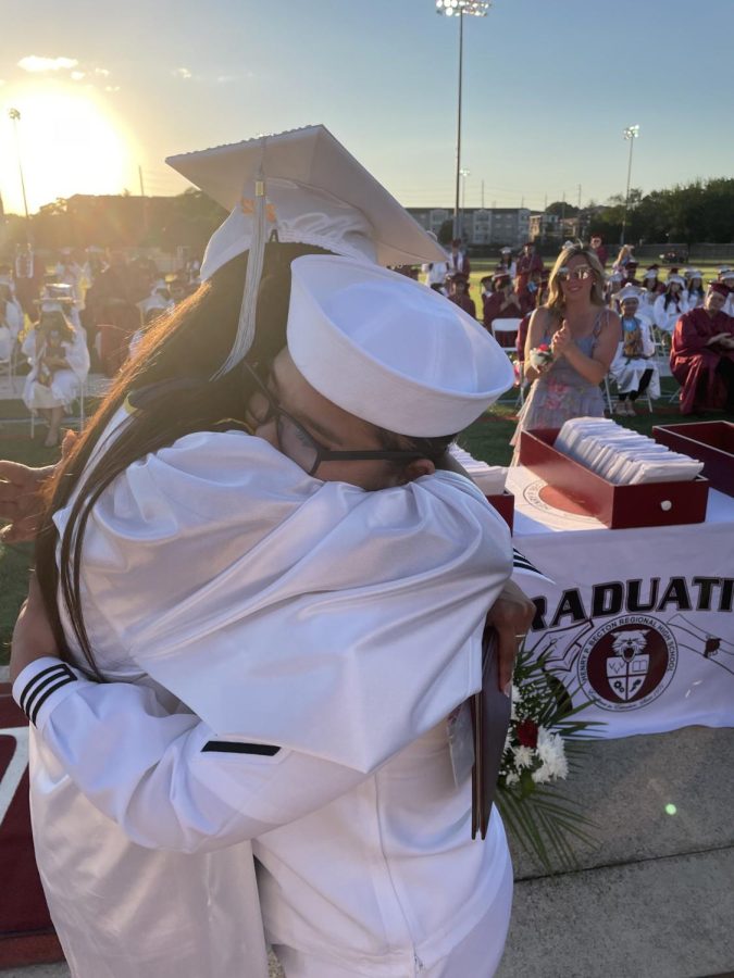 Becton+honors+Veterans+Day+this+year+and+every+day%2C+with+the+guidance+of+Alumni+Affairs%2FMilitary+Appreciation+Coordinator%2C+Michele+Ferris.+Pictured+is+recent+2022+Graduate+Sebrina+Castillo+receiveing+her+diploma+from+her+US+Navy+sister+who+surprised+her+at+graduation.+