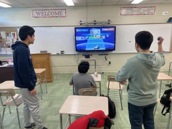 Video-game club members playing a game