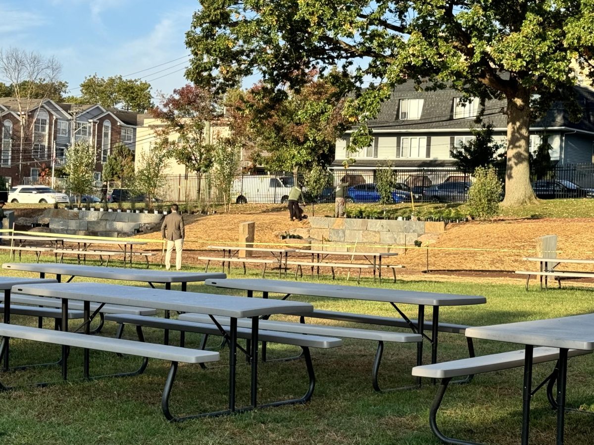 Dr. Sforza admiring the construction of our brand-new outdoor wellness area for staff and students to utilize throughout the school year.